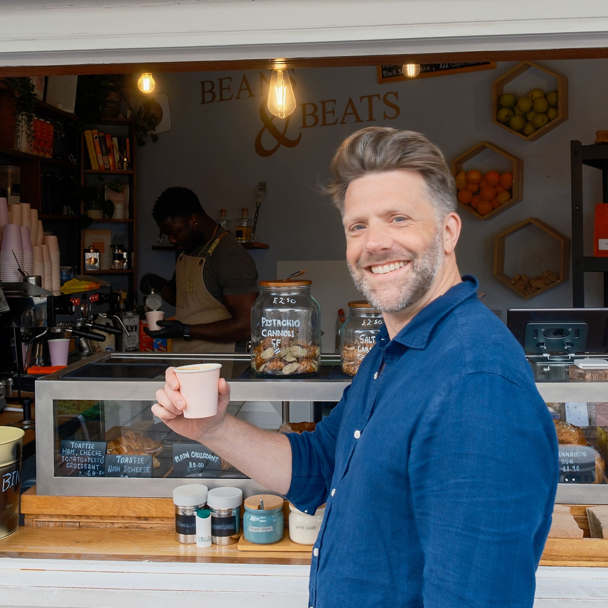Anthony (Founder of The Fifth) getting a flat white from Beans & Beats cafe in Brixton, London
